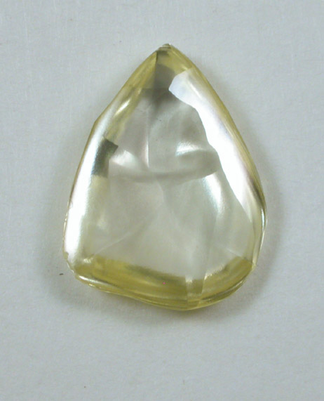 Diamond (1.28 carat fancy yellow flattened crystal) from Lunda Province, Angola