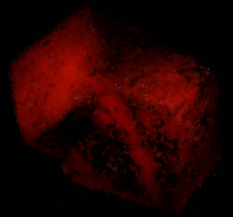 Photo below under longwave ultraviolet illumination of Calcite (interpenetrant-twinned crystals) with Calcite overgrowth from Naica District, Saucillo, Chihuahua, Mexico Calcite (interpenetrant-twinned crystals) with Calcite overgrowth from Naica District, Saucillo, Chihuahua, Mexico